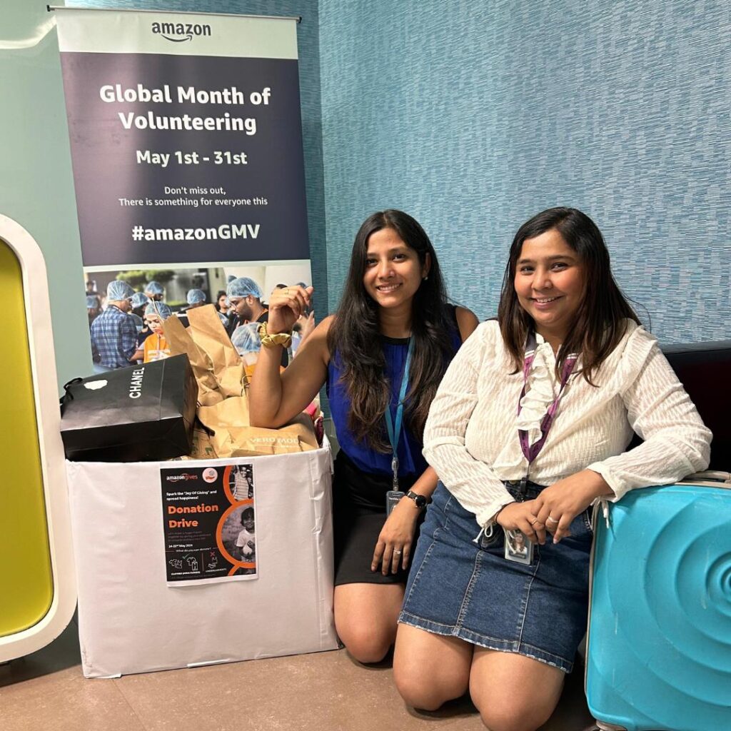 Amazon employees capturing their giving moments during Global Volunteering Month's donation drive with Share At Door Step.